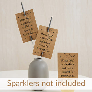 Three kraft sparkler card funeral favours with black script text reading 'Please light a sparkler and take a moment to remember.