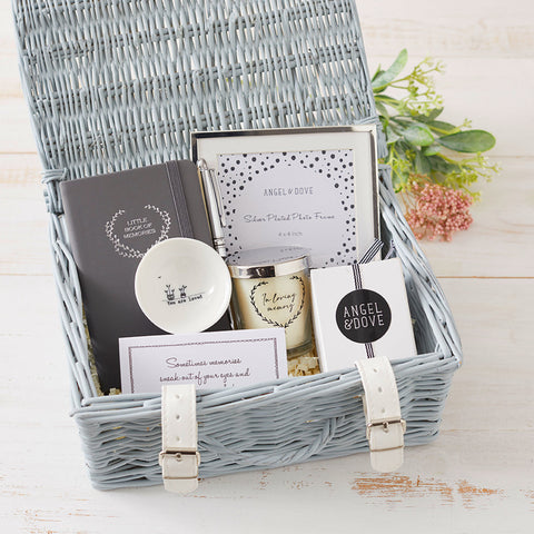 Sending Sympathy Wicker Gift Hamper containing a candle, frame, notebook, pen, bowl and tissues
