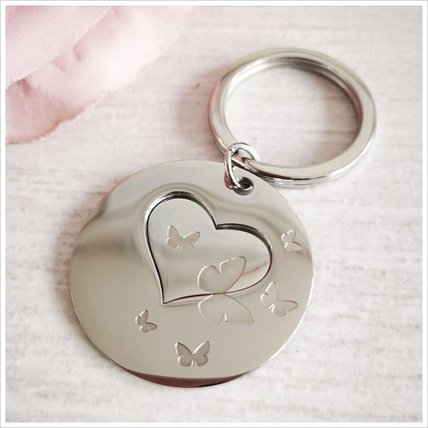 'Heart In Their Hand' Butterflies Remembrance Keyring - Angel & Dove